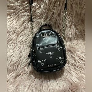 Black guess mini purse.